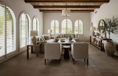 Custom white plantation shutters in a bright living room